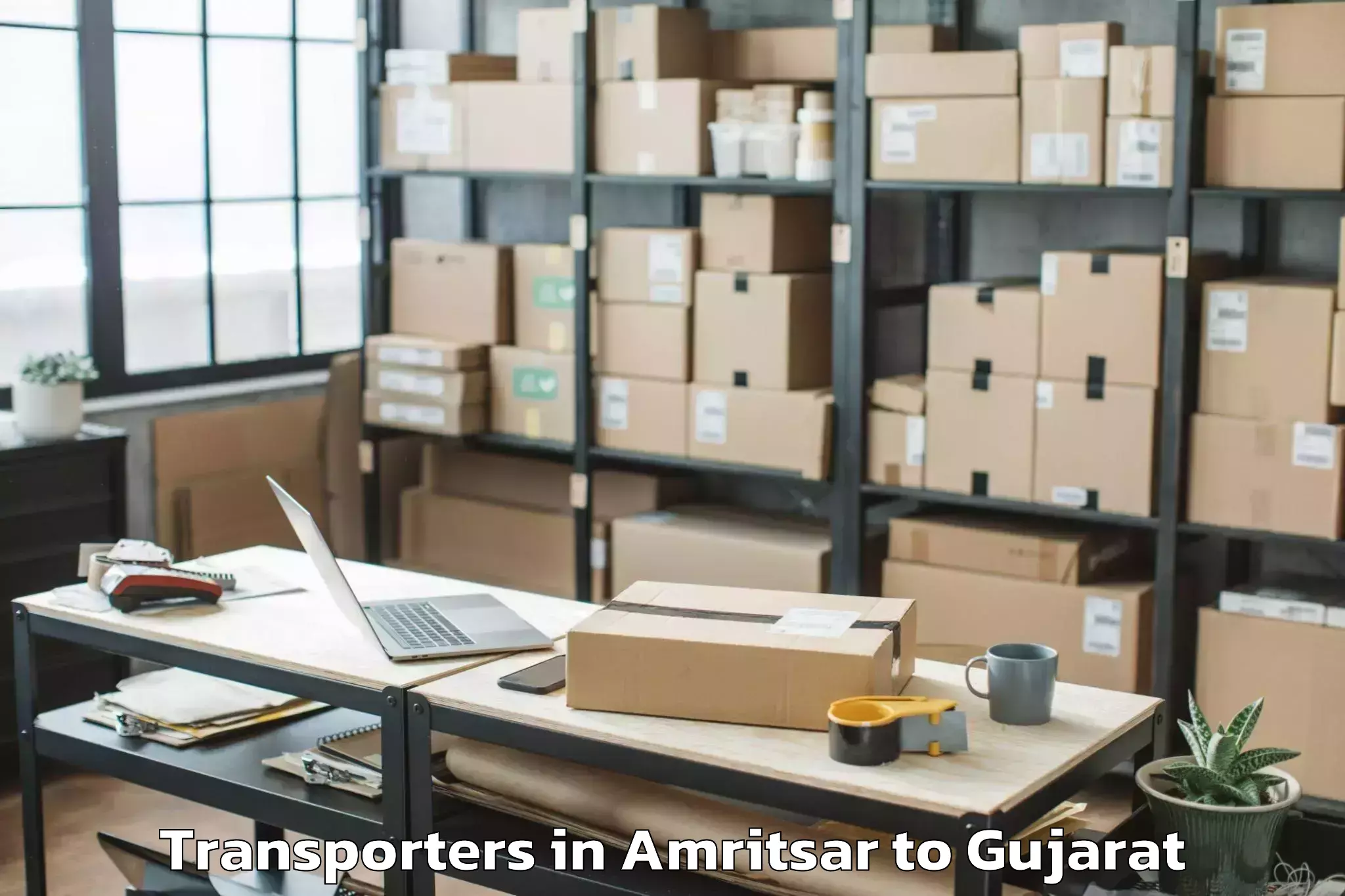 Top Amritsar to Upleta Transporters Available